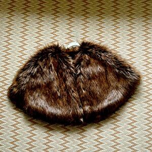 Beautiful dark brown faux fur wrap by Halogen. One size with top front clasp.